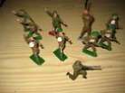 Ten metal toy soldiers from 1940s and '50s.